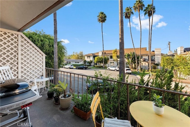 balcony featuring a grill and a residential view