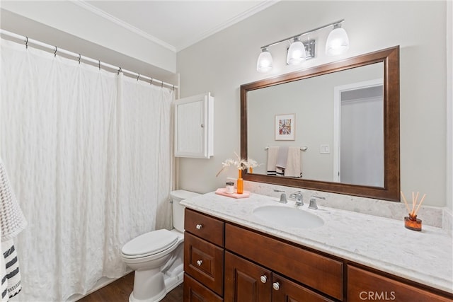 full bathroom with ornamental molding, toilet, wood finished floors, and vanity