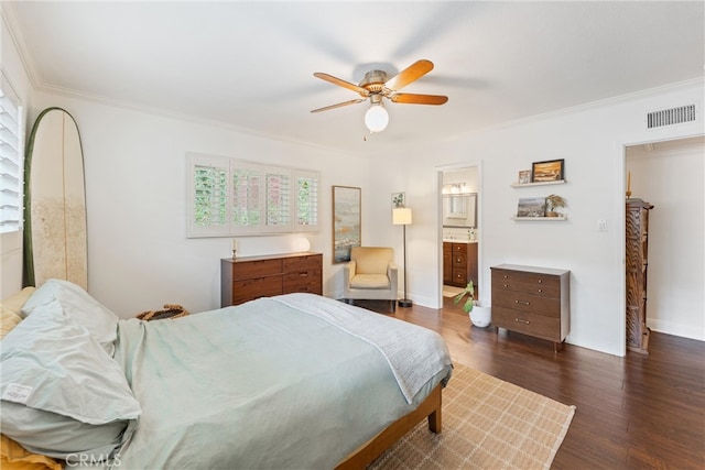 bedroom featuring a ceiling fan, dark wood-style flooring, ornamental molding, and visible vents
