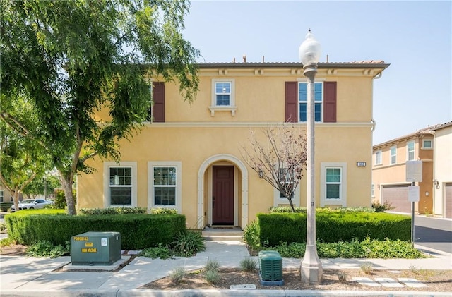 mediterranean / spanish-style home featuring stucco siding