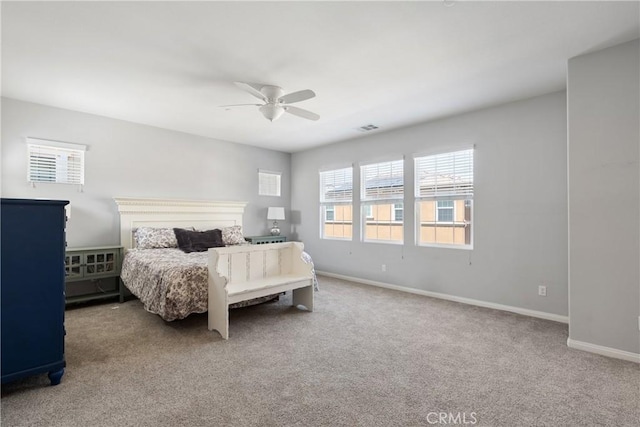bedroom with ceiling fan, carpet floors, baseboards, and visible vents