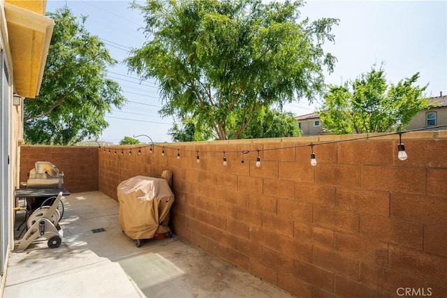 view of patio / terrace featuring fence
