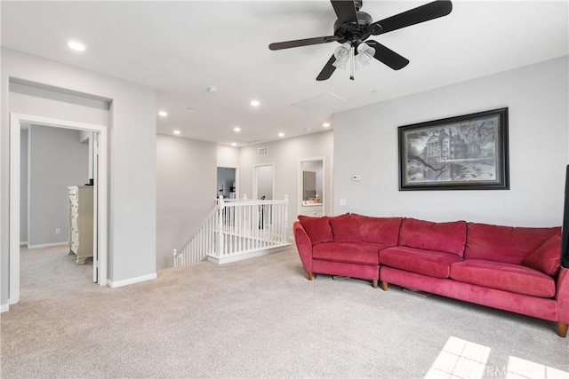 carpeted living room featuring ceiling fan, baseboards, and recessed lighting