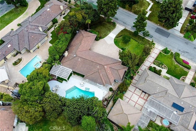 aerial view of property's location featuring a pool area