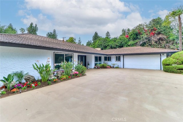 view of front of property with an attached garage and driveway