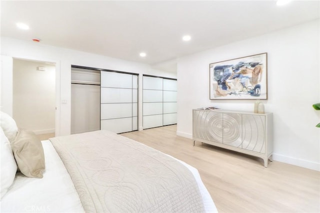bedroom with light wood-style floors, baseboards, and recessed lighting