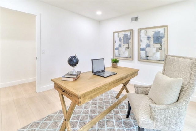 office space featuring light wood-style floors, baseboards, and recessed lighting