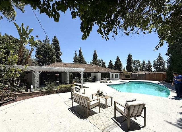 view of pool with a pergola, a fenced backyard, and a patio area