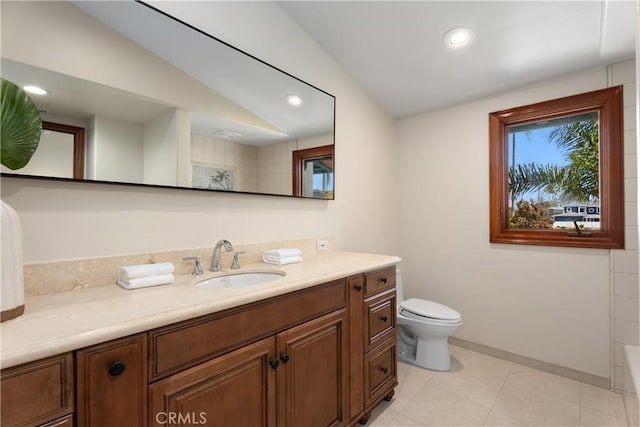full bath with toilet, vanity, and recessed lighting