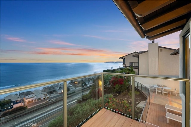 balcony with a view of the beach and a water view