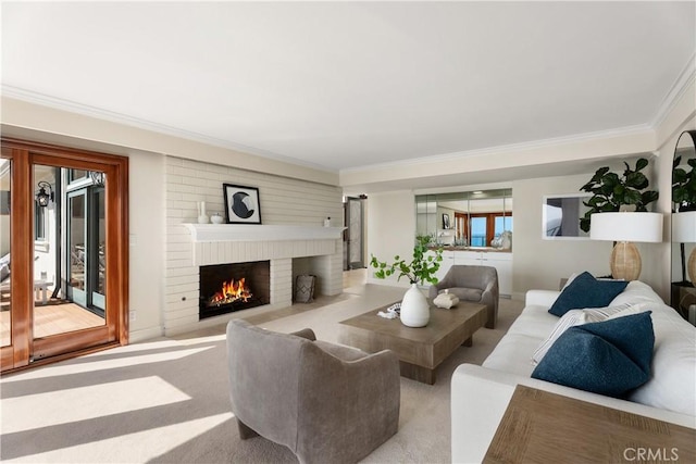 carpeted living area with a fireplace and ornamental molding