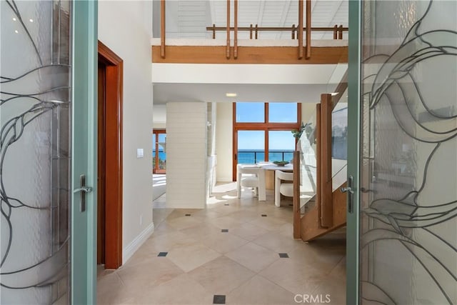 35451 Camino Capistrano, Dana Point, CA 92624 - entrance foyer featuring a water view, french doors, and light tile patterned flooring