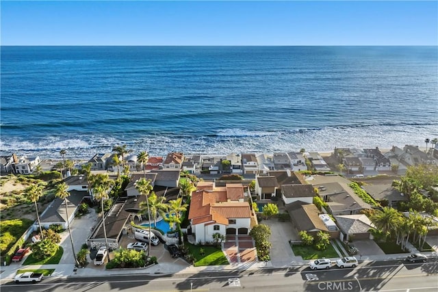 birds eye view of property with a water view and a residential view