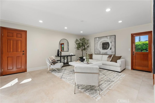 living room with crown molding, baseboards, and recessed lighting