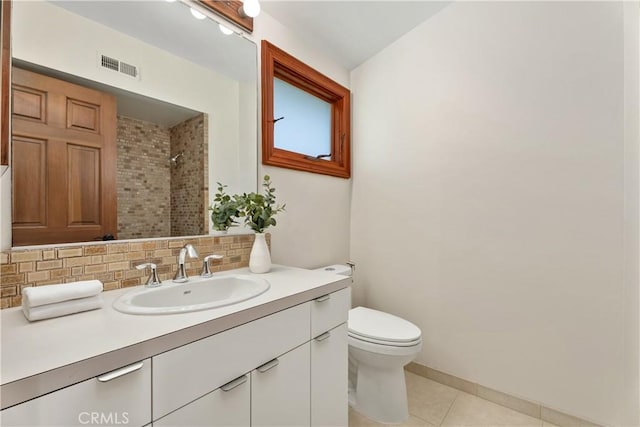 35451 Camino Capistrano, Dana Point, CA 92624 - bathroom featuring decorative backsplash, vanity, tile patterned floors, and tiled shower