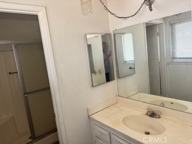 14122 Pawnee Rd, Apple Valley, CA 92307 - full bath featuring a stall shower and vanity