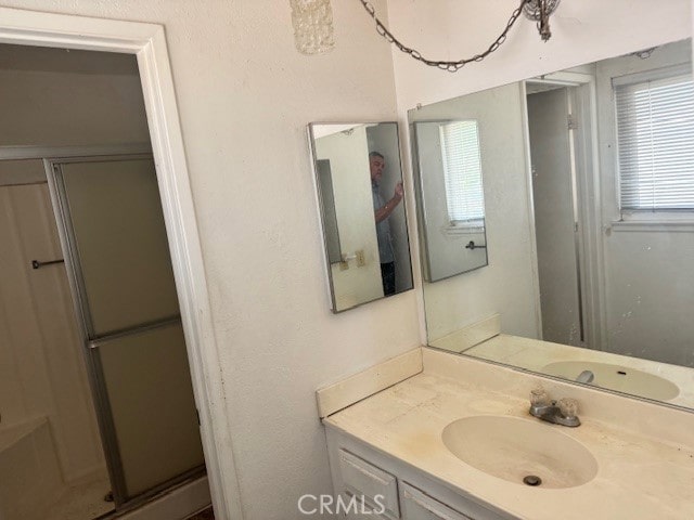 14122 Pawnee Rd, Apple Valley, CA 92307 - full bath featuring vanity and a shower stall