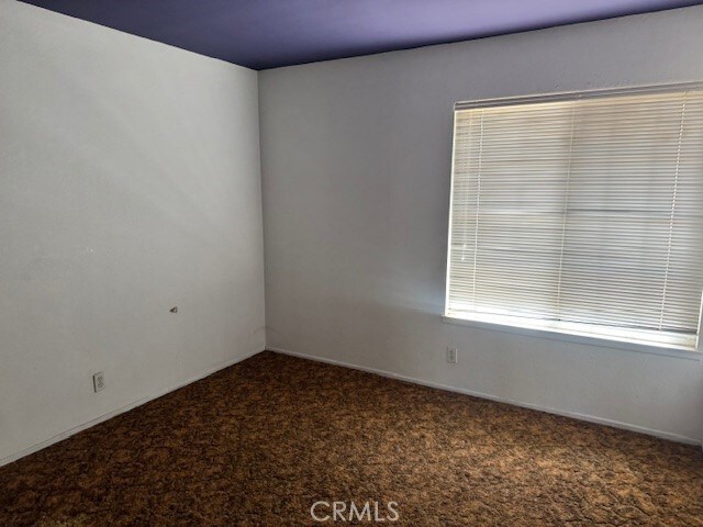 14122 Pawnee Rd, Apple Valley, CA 92307 - spare room with carpet flooring