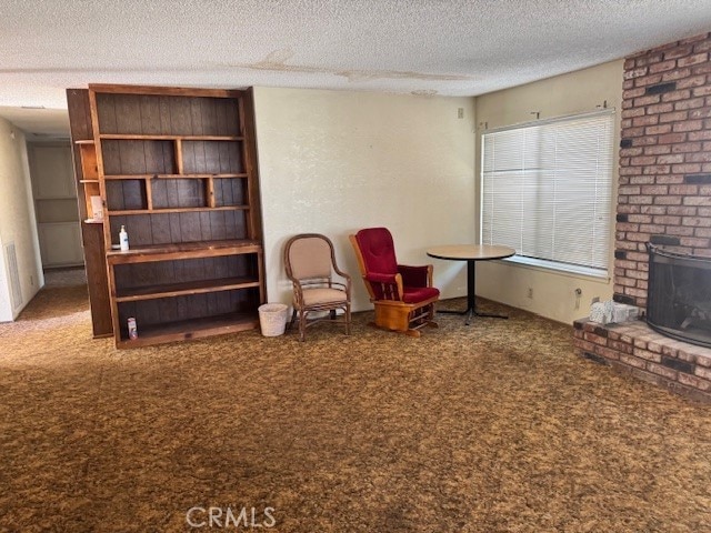 14122 Pawnee Rd, Apple Valley, CA 92307 - living area with carpet and a textured ceiling