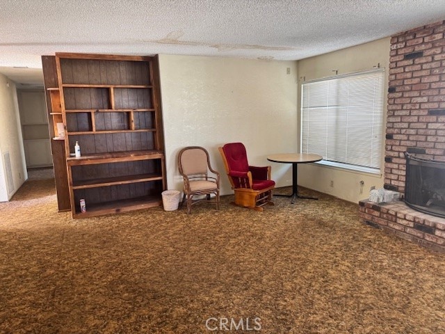 14122 Pawnee Rd, Apple Valley, CA 92307 - living area with carpet floors and a textured ceiling