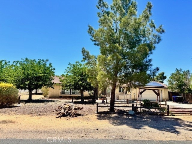 14122 Pawnee Rd, Apple Valley, CA 92307 - view of front facade featuring fence and an attached garage