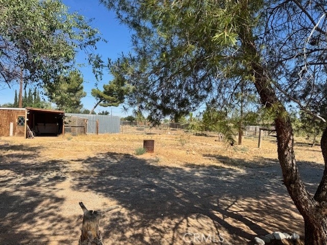 14122 Pawnee Rd, Apple Valley, CA 92307 - view of yard featuring an outbuilding
