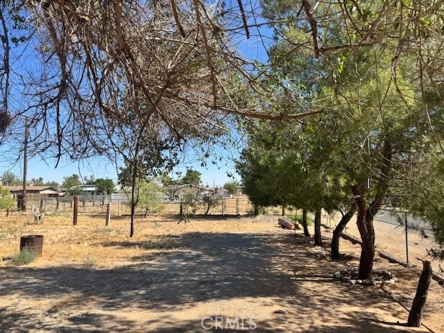 14122 Pawnee Rd, Apple Valley, CA 92307 - view of dirt / gravel road featuring a view of rural / pastoral area