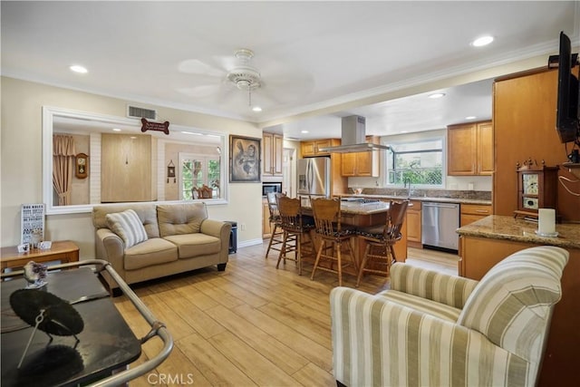 11300 Dulcet Ave, Porter Ranch, CA 91326 - living area with light wood-style floors, a ceiling fan, recessed lighting, and crown molding