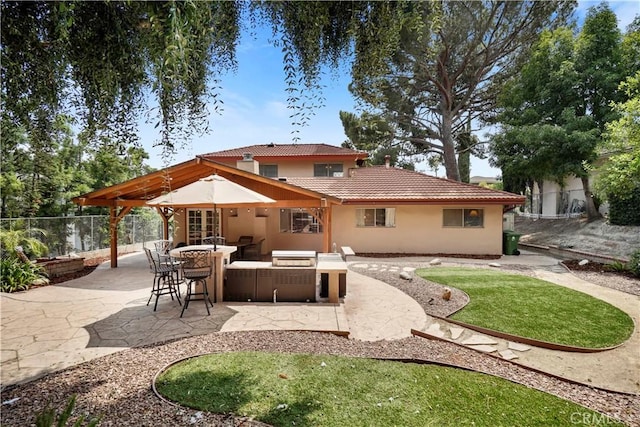11300 Dulcet Ave, Porter Ranch, CA 91326 - back of house featuring a patio, a tiled roof, and stucco siding