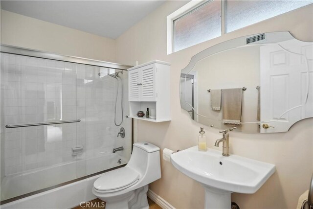 11300 Dulcet Ave, Porter Ranch, CA 91326 - bathroom featuring a sink and shower / bath combination with glass door