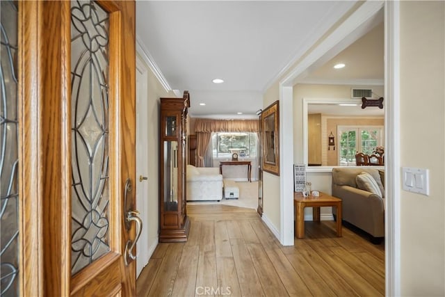 11300 Dulcet Ave, Porter Ranch, CA 91326 - foyer with crown molding, healthy amount of natural light, recessed lighting, light wood finished floors, and french doors