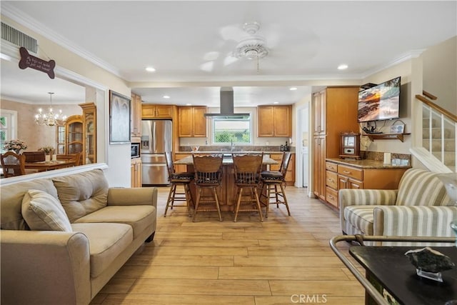 11300 Dulcet Ave, Porter Ranch, CA 91326 - living room with light wood-style floors, a chandelier, recessed lighting, crown molding, and a ceiling fan