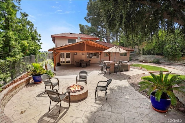 11300 Dulcet Ave, Porter Ranch, CA 91326 - view of patio featuring an outdoor fire pit, french doors, and outdoor dining space