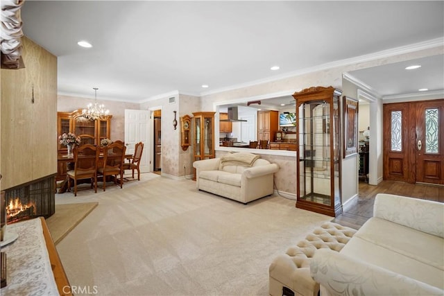 11300 Dulcet Ave, Porter Ranch, CA 91326 - living area with ornamental molding, a chandelier, recessed lighting, and light colored carpet