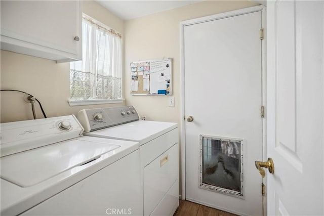 11300 Dulcet Ave, Porter Ranch, CA 91326 - laundry room with washer and dryer, cabinet space, and wood finished floors
