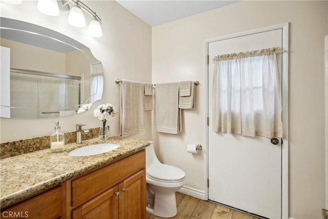 11300 Dulcet Ave, Porter Ranch, CA 91326 - bathroom with vanity, an enclosed shower, and wood finished floors