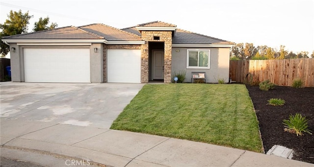 view of front facade featuring stone siding, an attached garage, stucco siding, fence, and concrete driveway