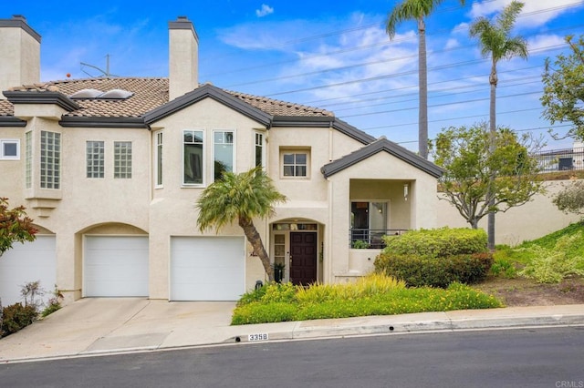 3358 Caminito Luna Nueva, Del Mar, CA 92014 - view of front of property featuring driveway, stucco siding, a garage, a chimney, and a tiled roof