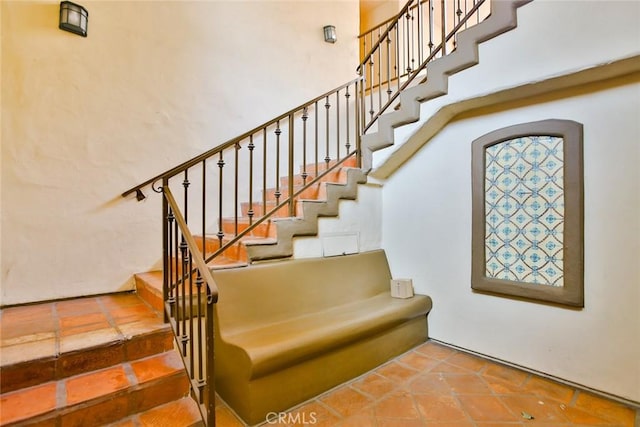 7100 La Tijera Blvd Unit B202, Los Angeles, CA 90045 - staircase with a high ceiling and tile patterned floors
