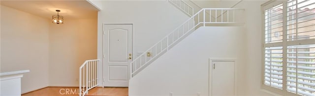 7100 La Tijera Blvd Unit B202, Los Angeles, CA 90045 - foyer entrance with wood finished floors, a towering ceiling, and stairs