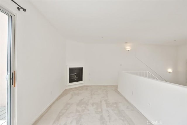 7100 La Tijera Blvd Unit B202, Los Angeles, CA 90045 - interior space featuring light carpet, baseboards, and a glass covered fireplace