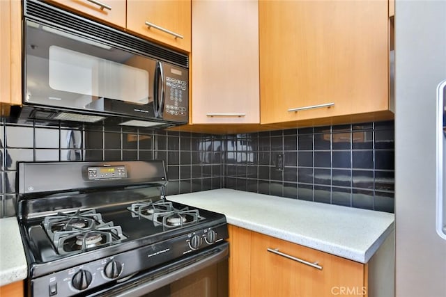 7100 La Tijera Blvd Unit B202, Los Angeles, CA 90045 - kitchen featuring black microwave, gas range, and backsplash