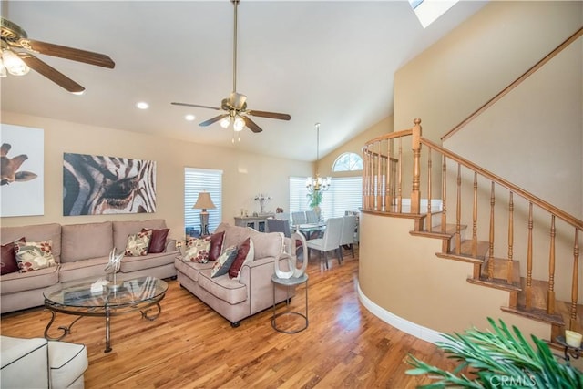 3251 Mountainside Dr, Corona, CA 92882 - living room featuring a ceiling fan, light wood-style floors, lofted ceiling, stairs, and recessed lighting