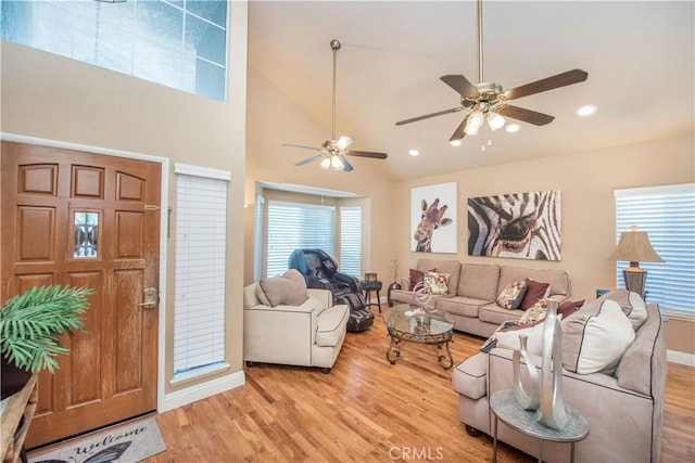 3251 Mountainside Dr, Corona, CA 92882 - living area featuring plenty of natural light, light wood finished floors, ceiling fan, recessed lighting, and high vaulted ceiling