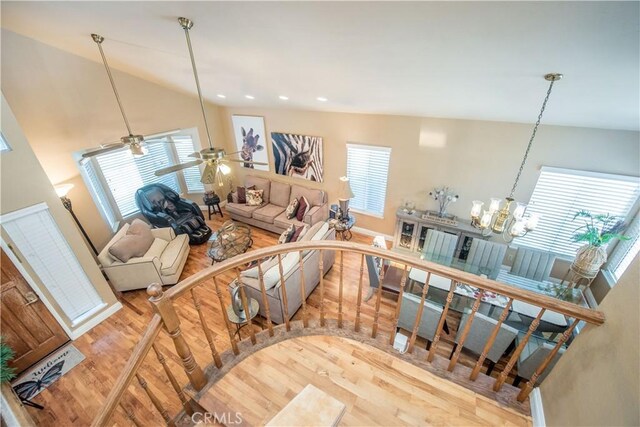 3251 Mountainside Dr, Corona, CA 92882 - stairway with wood finished floors, plenty of natural light, a chandelier, and lofted ceiling