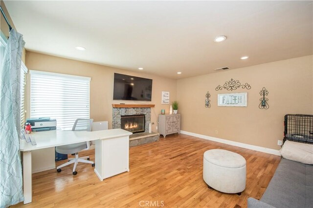 3251 Mountainside Dr, Corona, CA 92882 - office space featuring a glass covered fireplace, light wood finished floors, baseboards, and recessed lighting