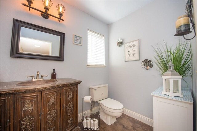 3251 Mountainside Dr, Corona, CA 92882 - bathroom with vanity, baseboards, and toilet