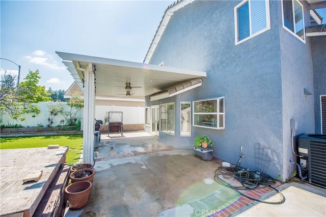 3251 Mountainside Dr, Corona, CA 92882 - view of patio / terrace with a ceiling fan, a fenced backyard, and central AC