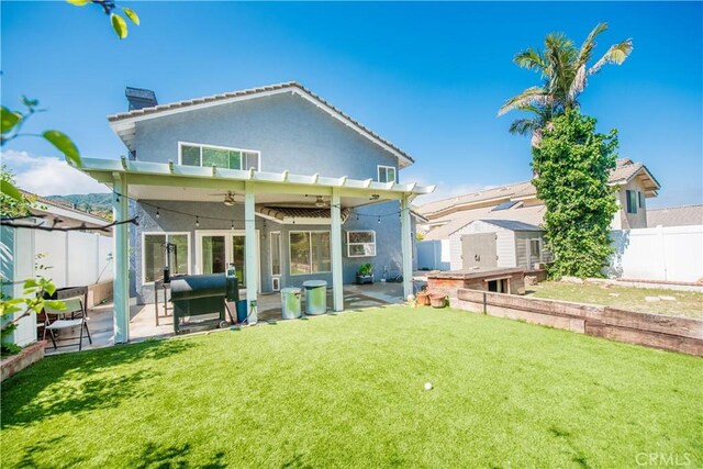 3251 Mountainside Dr, Corona, CA 92882 - rear view of house with ceiling fan, a storage shed, stucco siding, and a patio