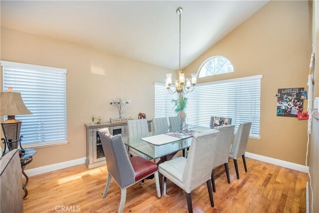 3251 Mountainside Dr, Corona, CA 92882 - dining area with a chandelier, light wood-style flooring, baseboards, and lofted ceiling